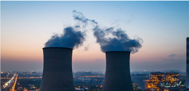 An image of a pair of cooling towers at dusk. The Ecotec Group provides world-leading equipment that monitors emissions of assorted gasses, including carbon dioxide, carbon monoxide, and other greenhouse gasses. Accurate detection and monitoring is essential for any business seek to comply with emission regulations, such as those required for carbon credits.