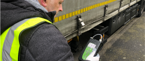 A picture of a field operative welding one of Ecotec's GFM hand-held gas analyzers. These devices allow you to quickly and accurately determine gas stream composition in situ.